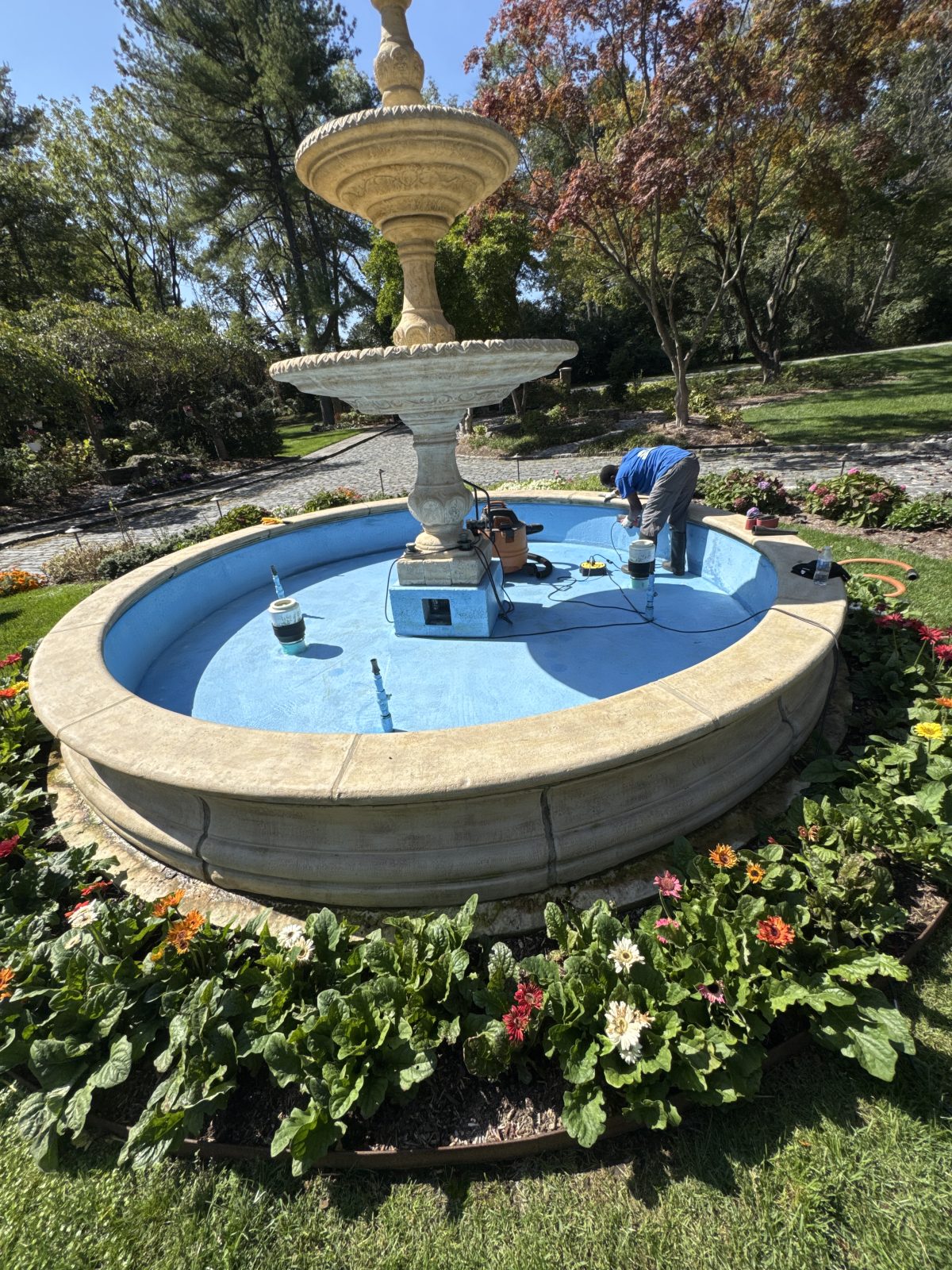 Landscaped pond and water feature requiring seasonal care